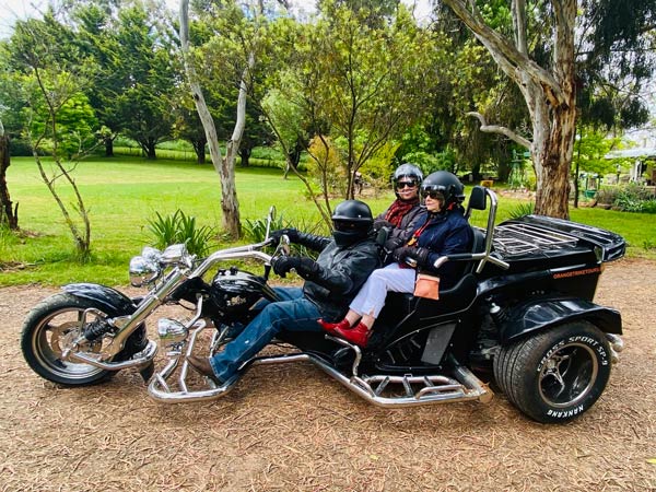 Two people enjoying an Orange Trike Tour