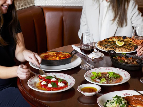 a spread of food on the table at Puttanesca Osteria