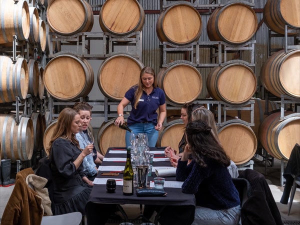 A small Uncork Orange tour group at a wine tasting in Orange