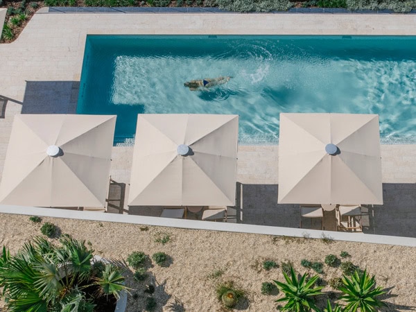top view of a woman swimming in the pool at Kirra Point