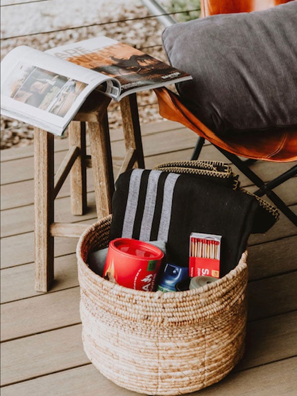 a book and a basket of goods at Evamor Valley
