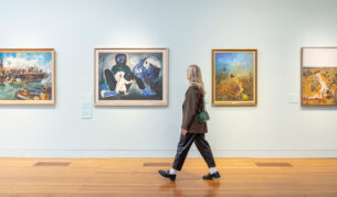 Woman admires artworks at Bendigo Art Gallery