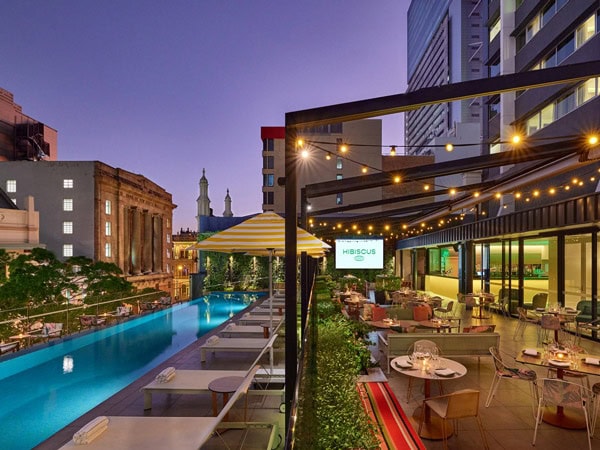 al fresco dining beside the infinity pool at Hibiscus Bar & Terrace, Brisbane
