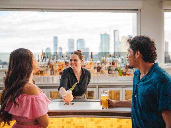 a couple ordering drinks at Iris Rooftop, Brisbane