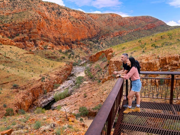 a couple admiring the view from Ormiston Gorge lookout