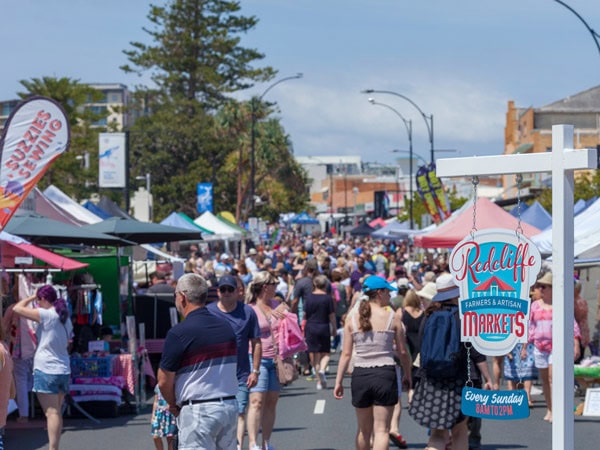 crowds of people shopping at Redcliffe Markets