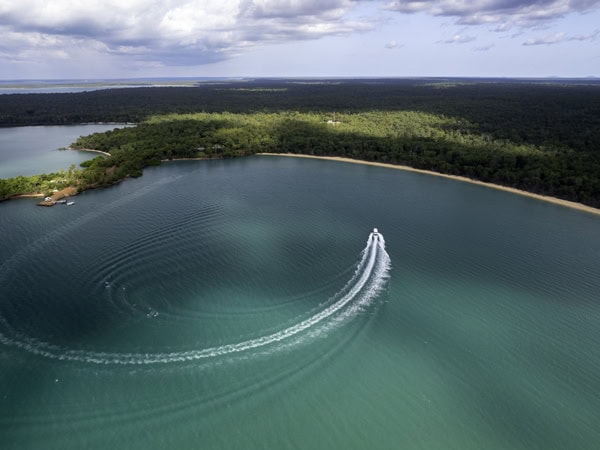Boat on the water at Seven Spirit Bay in Arnhem Land