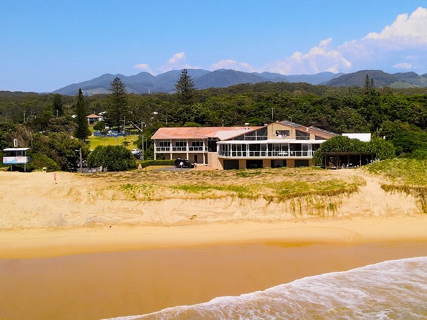 a drone shot of Donovan’s Surf Club Restaurant and Bar on the beach