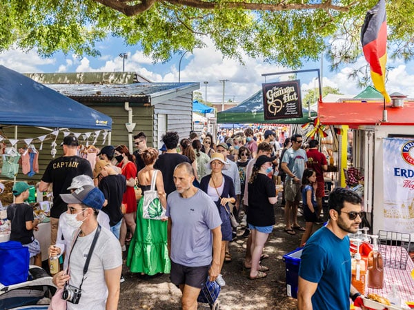 crowds of people shopping at West End Markets