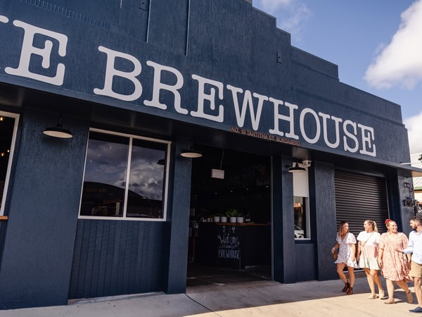 friends walking into the brewhouse at Ballistic Beer Co.
