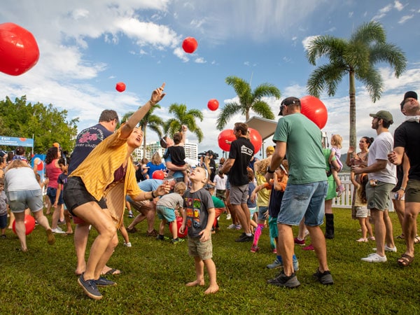 Families playing KeepyUppy on the Esplanade in Cairns