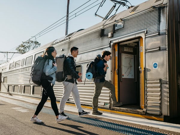 Young people catching a train at Katoomba train station.