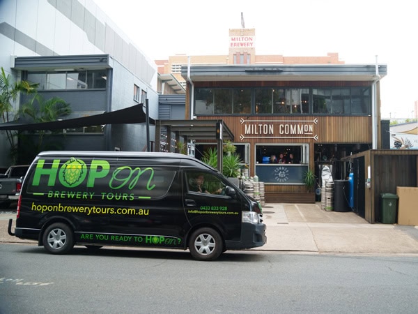 a van parked in front of Milton Common building