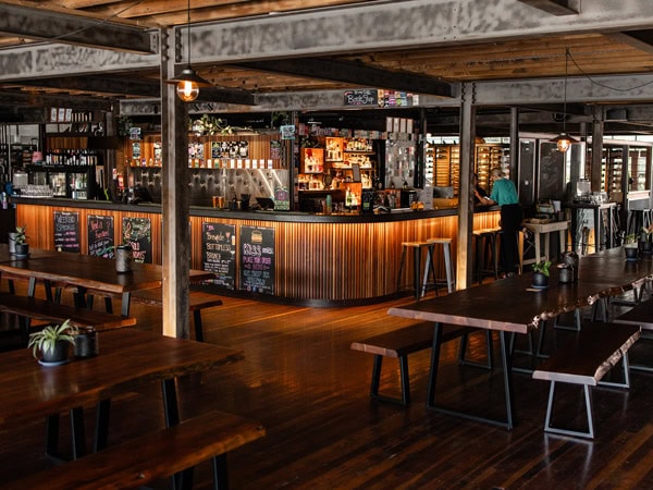 the dimly lit interior of Brewtide Brewery, Brisbane