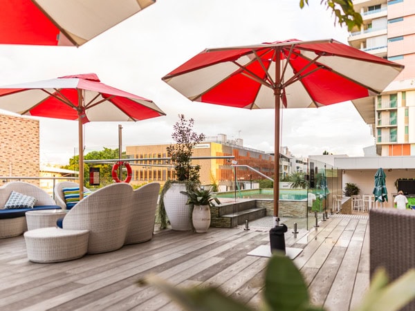 red-striped umbrellas at the Soleil Pool Bar