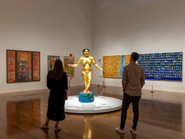 two people looking at the installations inside Queensland Art Gallery & Gallery of Modern Art