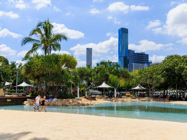 People walking past Streets Beach in South Bank Brisbane