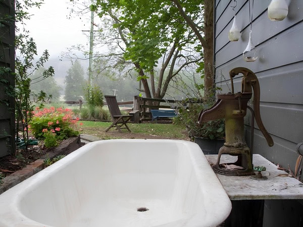 a traditional water pump with sink outside The Dairy at Broger’s End