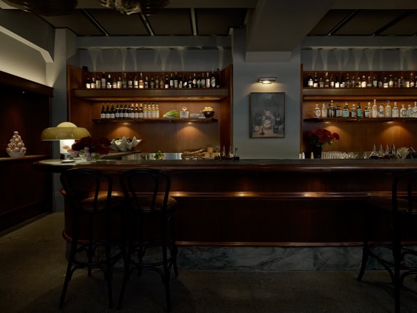 the dimly lit bar interior of Apollo Inn