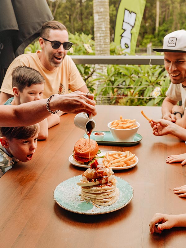 A family enjoying The Big Banana Cafe