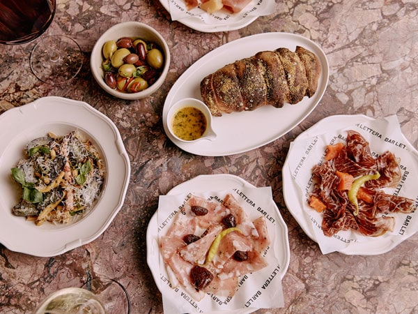 a table-top view of dinner plates at Bar Lettera