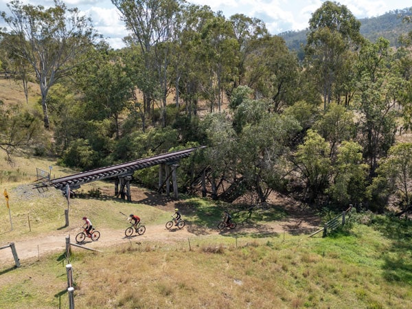 an aerial view of bikers along the Brisbane Valley Rail Trail