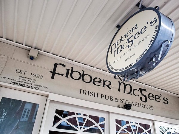 the Fibber McGee's sign at the entrance of the pub