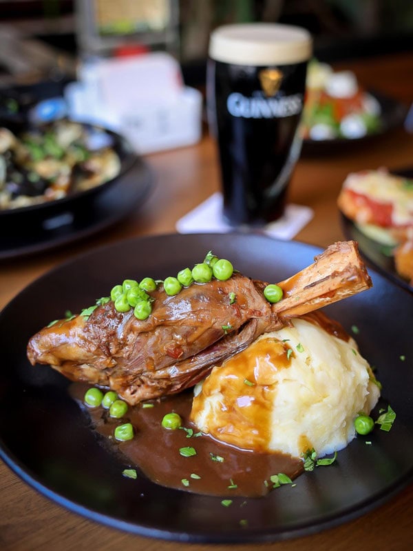 Lamb shank, potato and a guinness at Fiddlers Green.