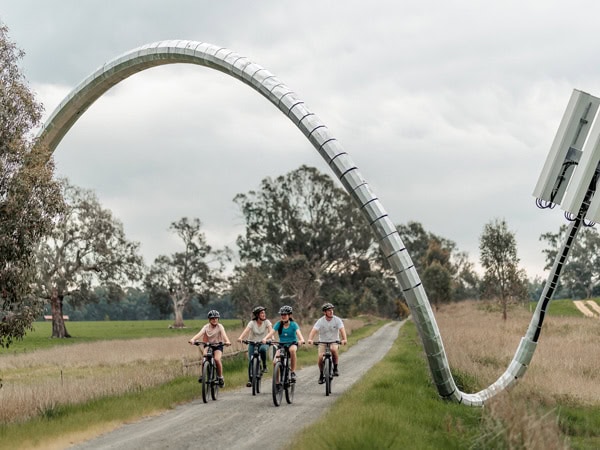 bikers passing by the beautiful curve along the Great Victorian Rail Trail