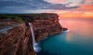 a scenic view of Curracurrong Falls at sunset