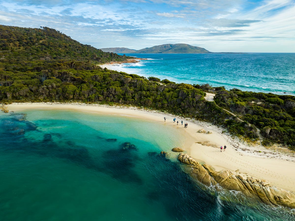 an aerial view of sapphire seas and lush greenery on Flinders Island