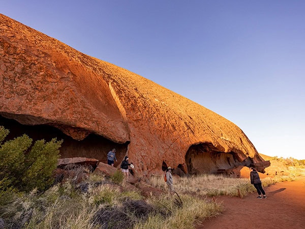 tour group hiking around uluru