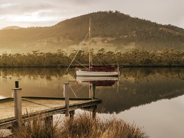 a scenic landscape of the Huon Valley and lake