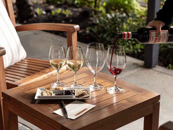 pouring red wine into a glass at Jim Barry Wines