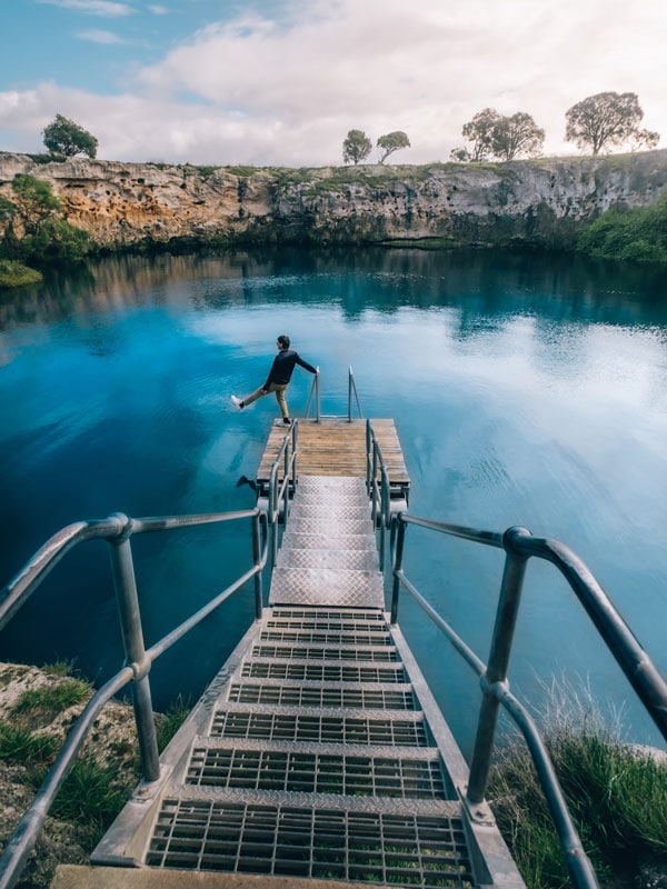 a man about to jump into the Little Blue Lake, Mount Gambier