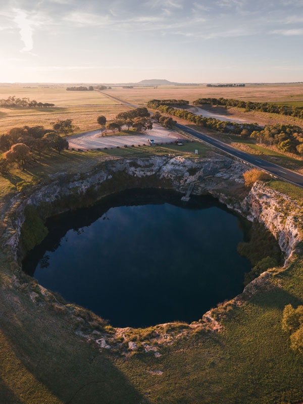 an aerial view of the Little Blue Lake sinkhole in Mount Gambier