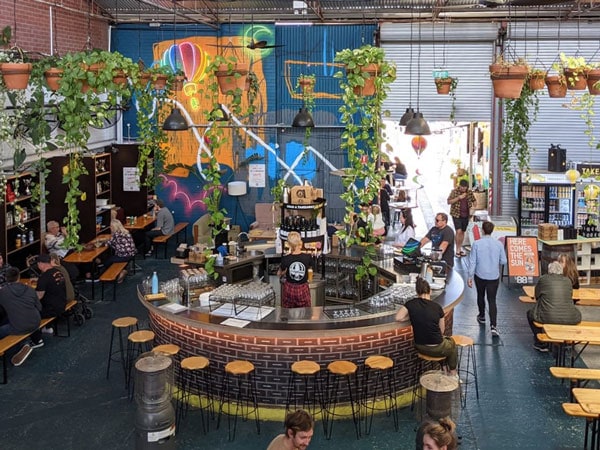 the funky circular bar with hanging pots inside the Otherside Brewhouse