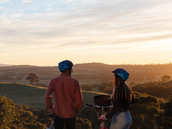a couple admiring the view from Paulett Wines’ Bush DeVine Restaurant in Polish Hill