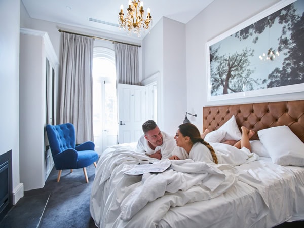 a couple in bed at The Crafers Hotel
