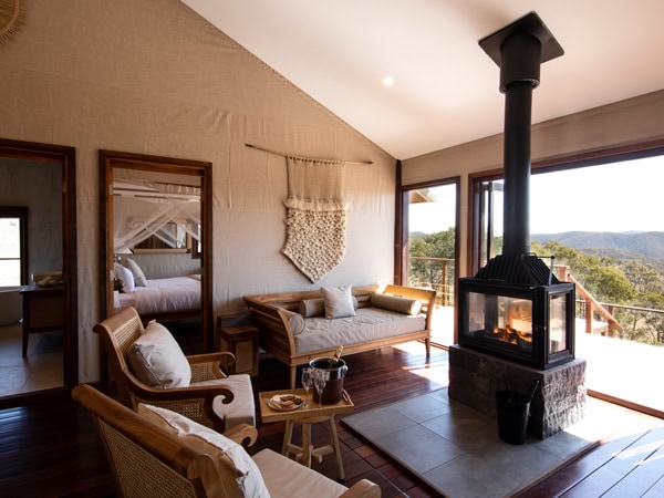the living room of Turon Gates Mountain Getaway with a balcony and a fireplace