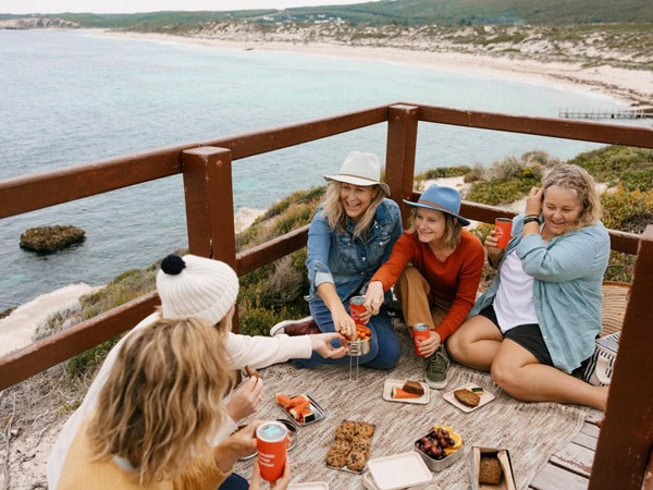 Women gather for a picnic after their ocean swim