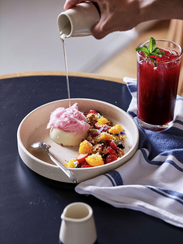 pouring syrup over dessert at Emil’s Cafe, Pascoe Vale South