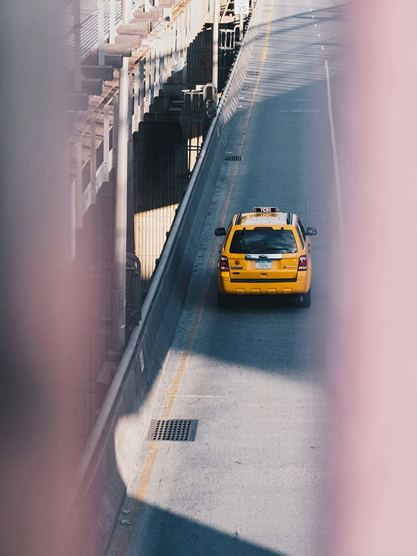 taxi crossing a bridge