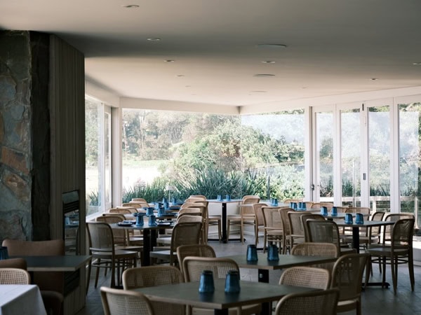 empty tables and chairs inside Almyra cafe in Lorne