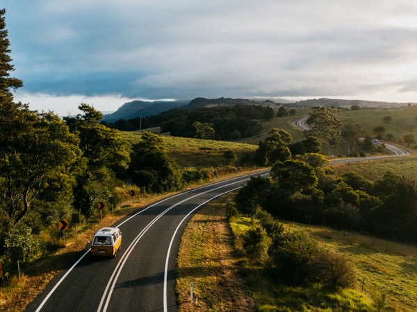 a campervan driving down country roads inBellingen