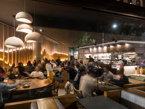 the dimly lit dining interior at Callao