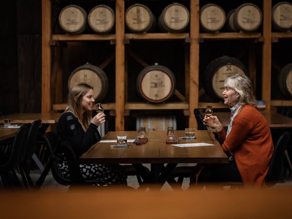 two women sampling whiskies at Callington Mill Distillery