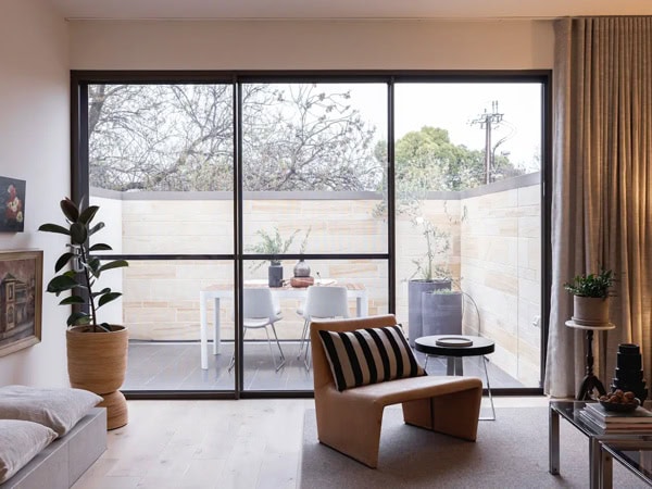 a huge window near the outdoor deck at this chic North Adelaide loft in Adelaide