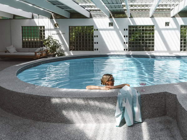 a woman relaxing in the pool at Flagstaff Estate, Hobart