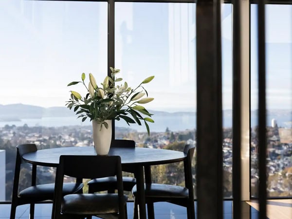 the dining table with scenic views of the city from Glass Holme, Hobart 